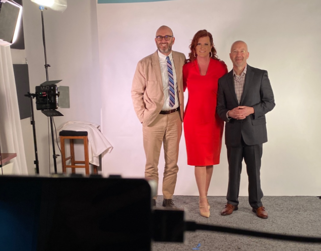 Three folks on a set